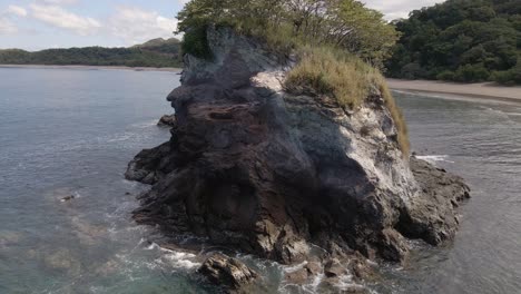 slow rotation around a small island full of life in the ocean