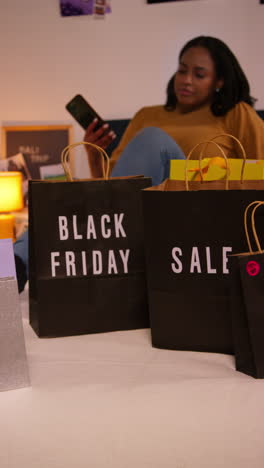 woman shopping for black friday deals at home