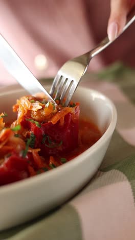 woman eating stuffed peppers