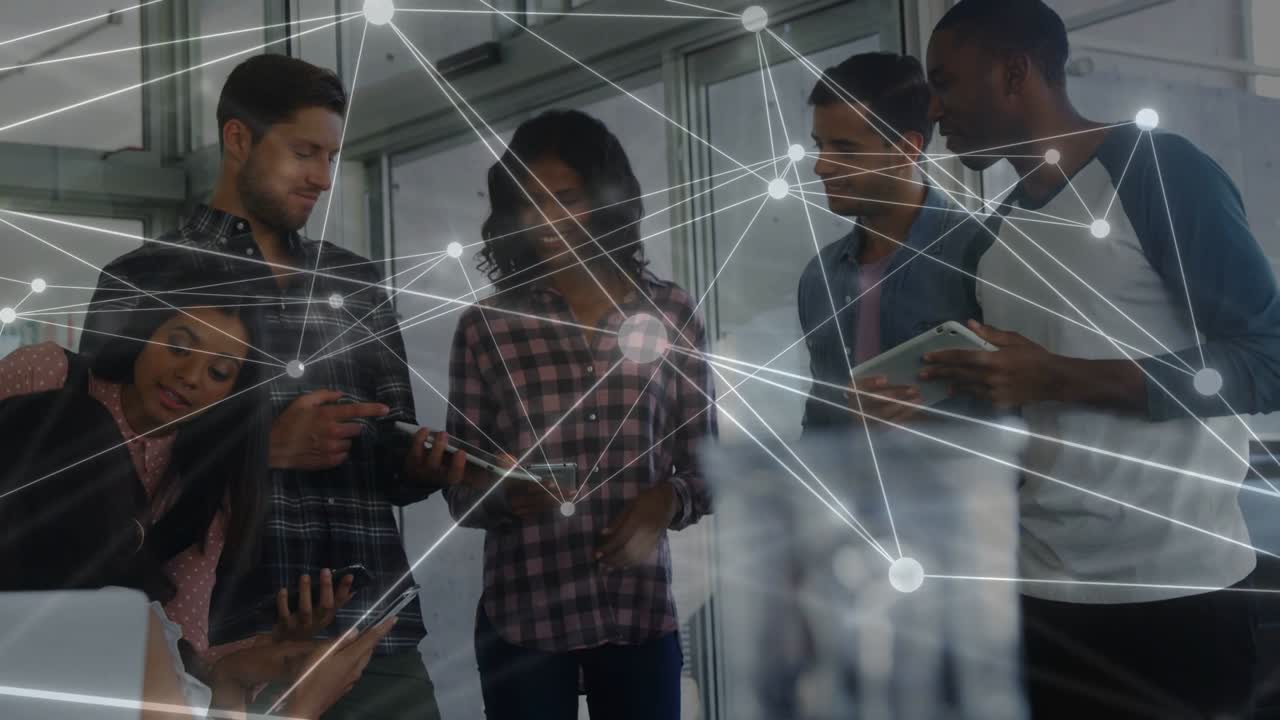 Team sharing tablets after lead woman tapping phone network nodes linking devices for business sync