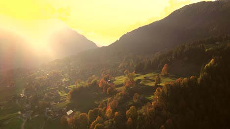 aerial drone footage rising up with sunset view of grindelwald valley