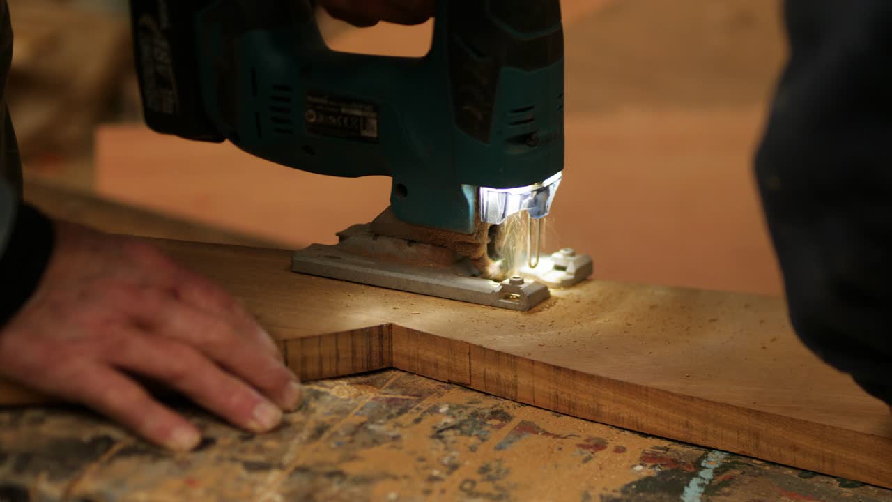 Carpenter Cutting Wood with Jigsaw, Precision Woodworking, Close Up View