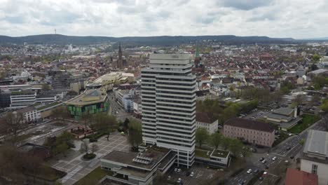 Aerial-cityscape-of-Downtown-Kaiserslautern-city-traffic-with-its-town-hall-and-shopping-mall,-Germany