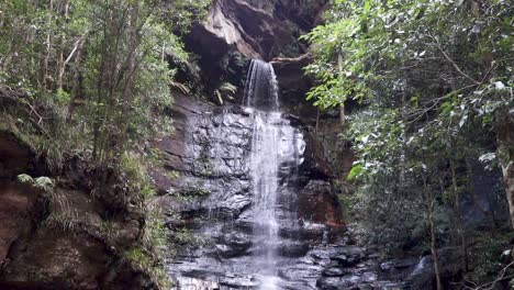 pan down shot of water cascading over wentworth falls, australia