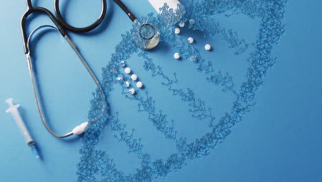 animatie van de dna-streng over pillen en stethoscoop