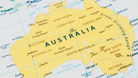 close-up of the country word australia on a world map with the detailed name of the capital city