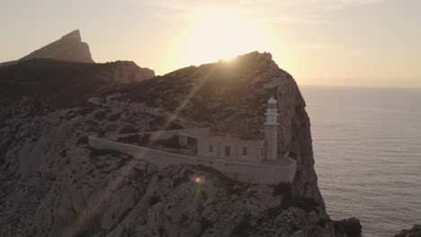 Amazing-sunset-at-Dragonera-Island-Mallorca-with-a-lighthouse,-aerial