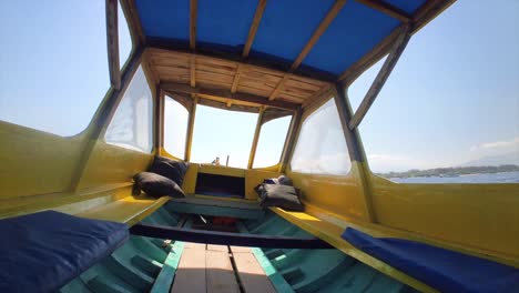 fishing boat in gili island indonesia cradled by the sea