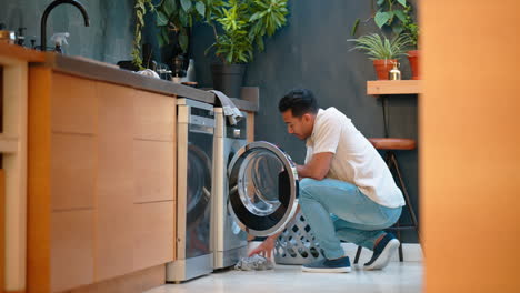 Washing-machine,-cleaning-and-man-with-laundry