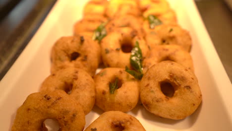 soft-fritter-medu-vada-closeup-South-Indian-dish-in-buffet