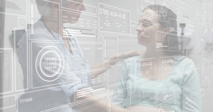 Doctor placing hand on patient shoulder while activating data panels, palpating abdomen for exam