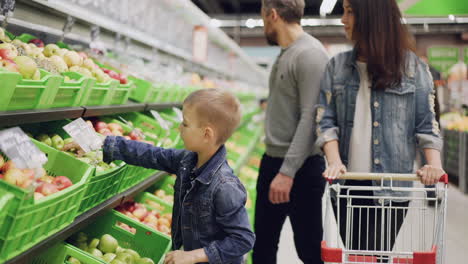 family shopping for fruits at the grocery store