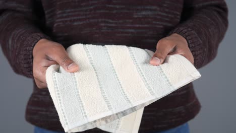 man holding a striped towel