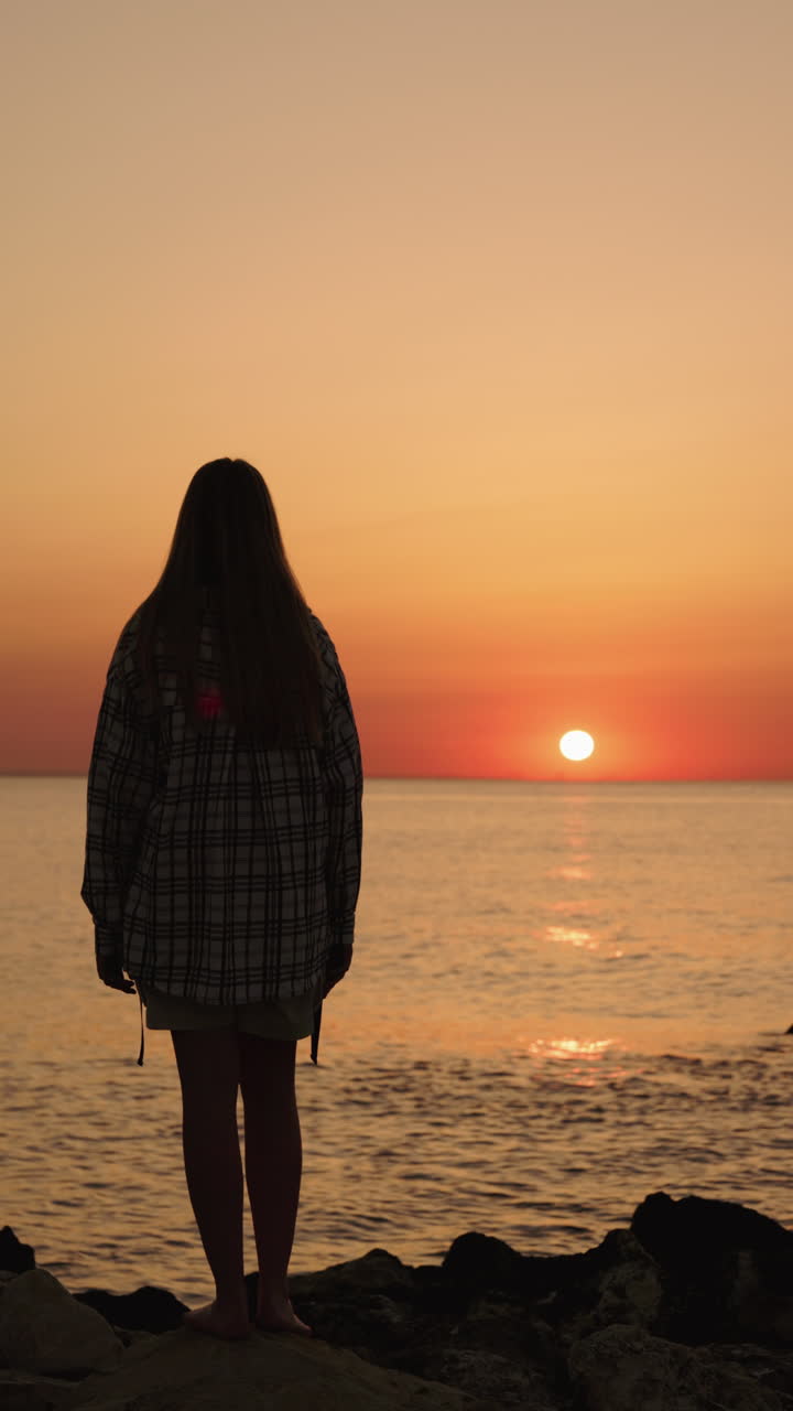 Woman Watching Sunset at the Beach