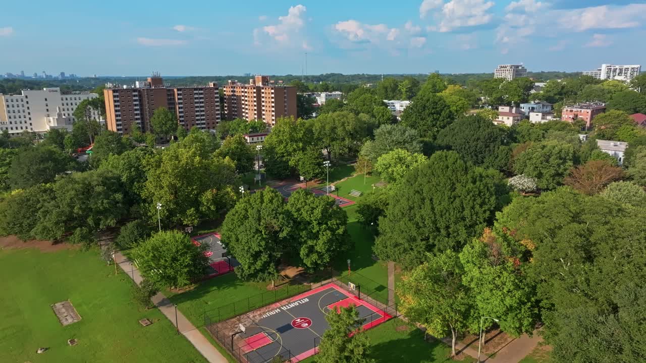 Basketball court in Central Park in Fourth West neighbourhood, Atlanta city urban park and playground, Georgia, Aerial