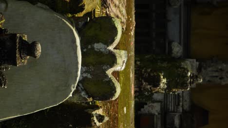 slow motion tilt up shot of a memorial stone in a hindu temple on bali in indonesia during a great adventurous trip