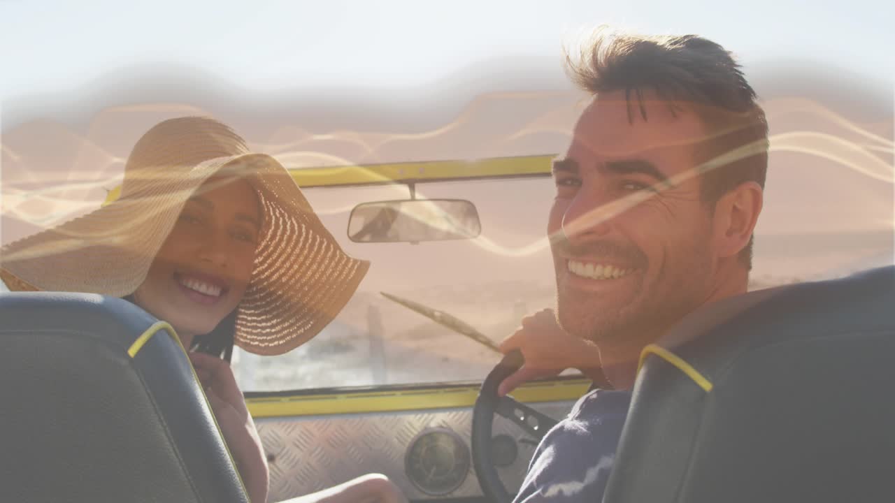 Driver driving and glancing as lens flare overlay sweeping, rider fixing hat, sharing smile on trip