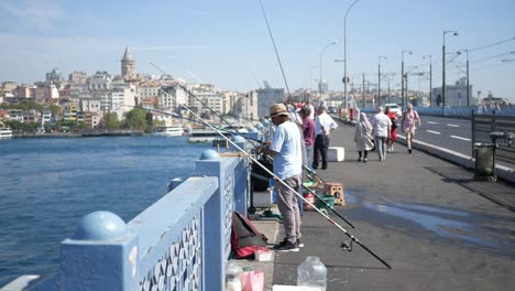 fishermen on the galata bridge in istanbul