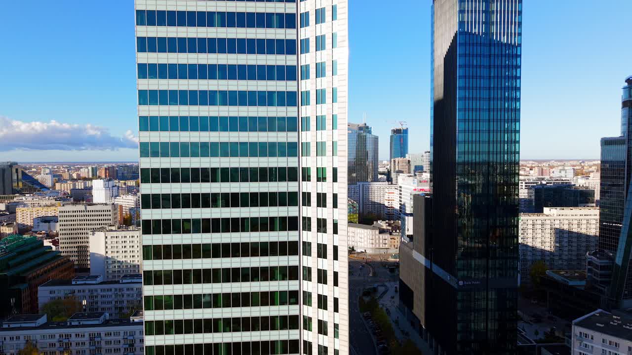 Warsaw Downtown Buildings, Poland. Drone Shot of Financial Center Skyscrapers and Street Traffic on Sunny Day