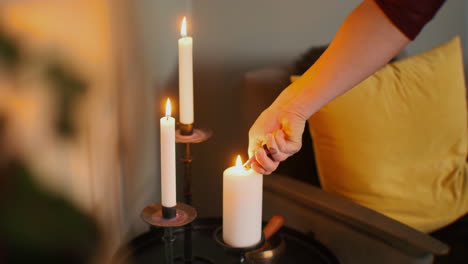 A-person-lighting-tree-candles-to-create-a-relaxing-atmosphere