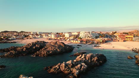 drone flyover beautiful bahia inglesa beach shoreline resort village, chile 4k resolution