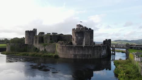 moat and defensive wall of caerphilly castle in south wales, uk