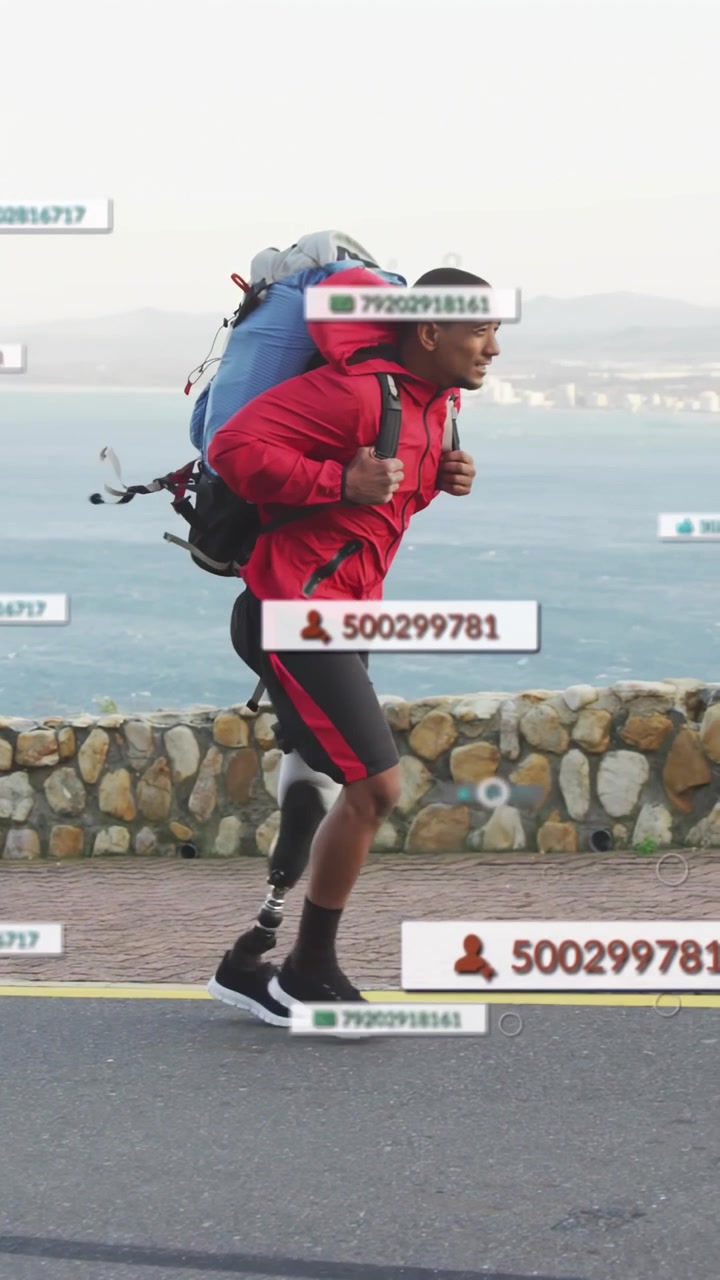 Vertical video: Hiker entering frame walking coast, activating UI tracking prosthetic leg health
