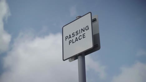 white metal passing place signage in uk with black border double sided