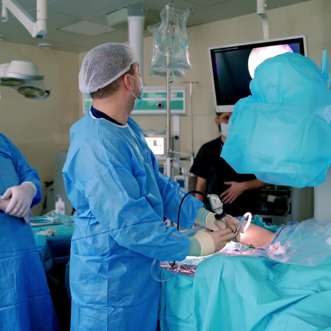 Medical instruments in surgeon's hands. Operating process in hospital. Doctors performing operation with surgery tools. Video