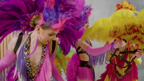 three dancers helping each other to get ready for the cabaret show 1