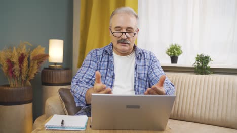 Man-making-video-call-on-laptop.