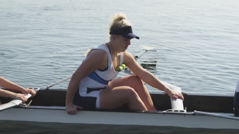 female rowing team training on a river