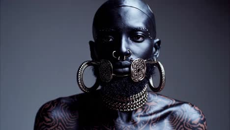 man with elaborate body art and jewelry