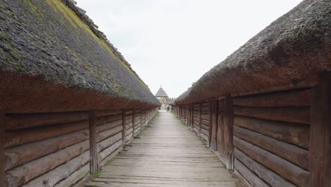 rooftops inside an archaeological site of biskupin and a life-size model of a late bronze age fortified settlement in poland