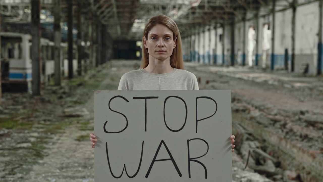 Woman Protesting War in Abandoned Factory