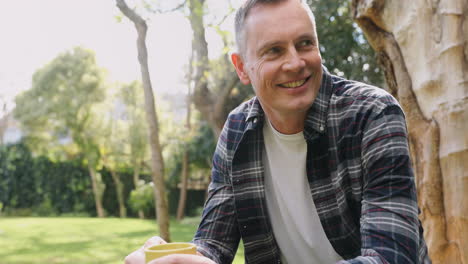 man having coffee on a sunny day 4k