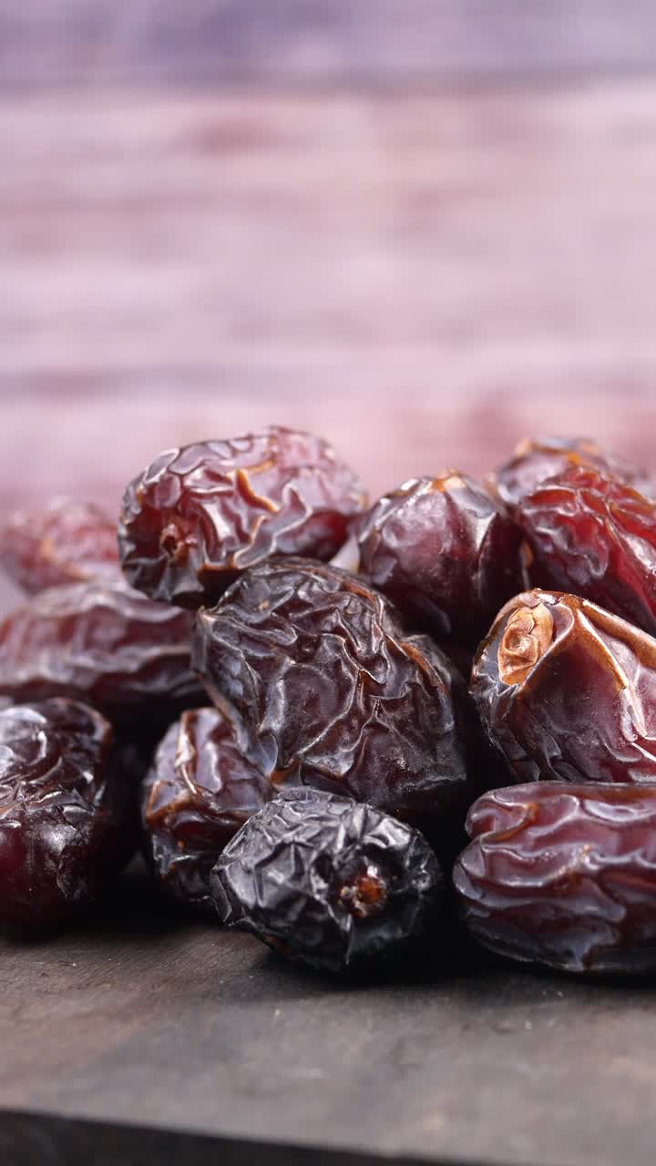 Close Up of a Pile of Sweet Dried Dates on Wood
