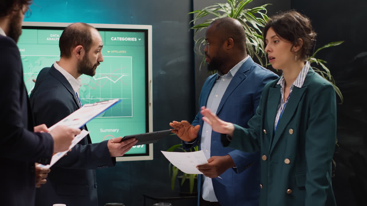 Startup colleagues reviewing data to improve customer satisfaction and retention