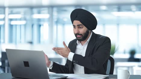 angry sikh indian businessman shouting on video call