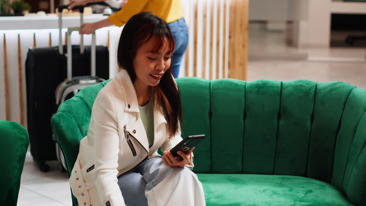 Modern person taking advantage of free wifi in lobby