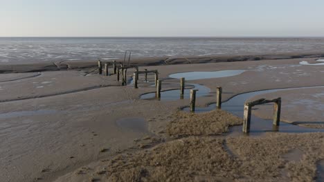 uk coastline the wash norfolk mud flat jetty ruins aerial landscape winter