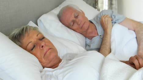 senior couple sleeping in the bedroom