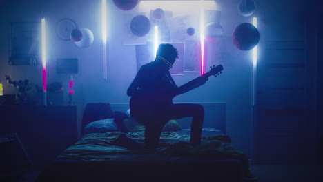 child playing guitar in a neon-lit bedroom
