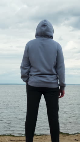 person contemplating on a beach