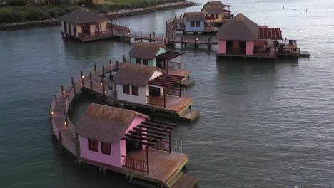 aerial shot of water bungalow in amber cove, dominican republic