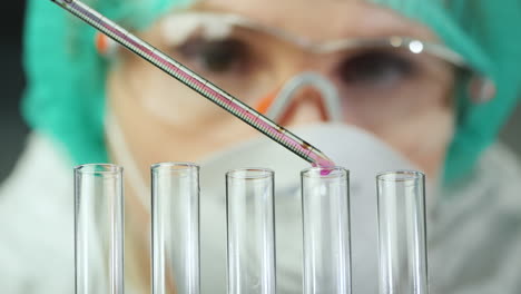 Female-researcher-works-in-the-laboratory-with-test-tubes-and-chemicals-1