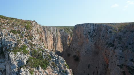 Slow-motion-drone-flight-through-a-rocky-canyon-mountain-range,-Europe