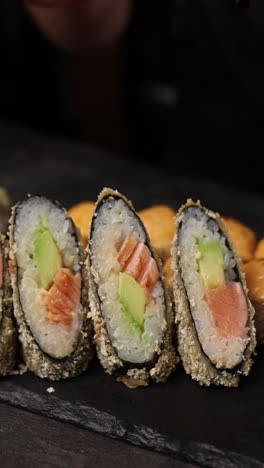 crispy fried salmon sushi rolls with sauce