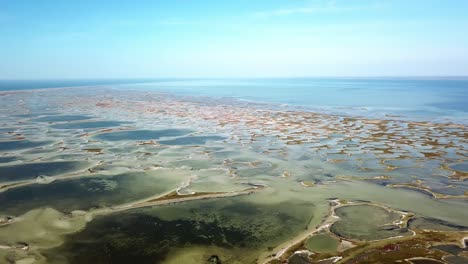 aerial view of round lakes near the sea