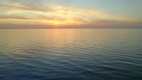 rippling sea under sunset sky